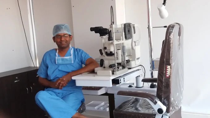 Doctor with ophthalmology examination equipment